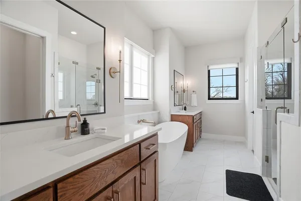 a bathroom with a sink double vanity and a mirror