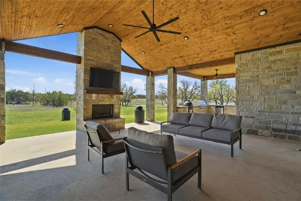 a building outdoor space with patio furniture and a garden