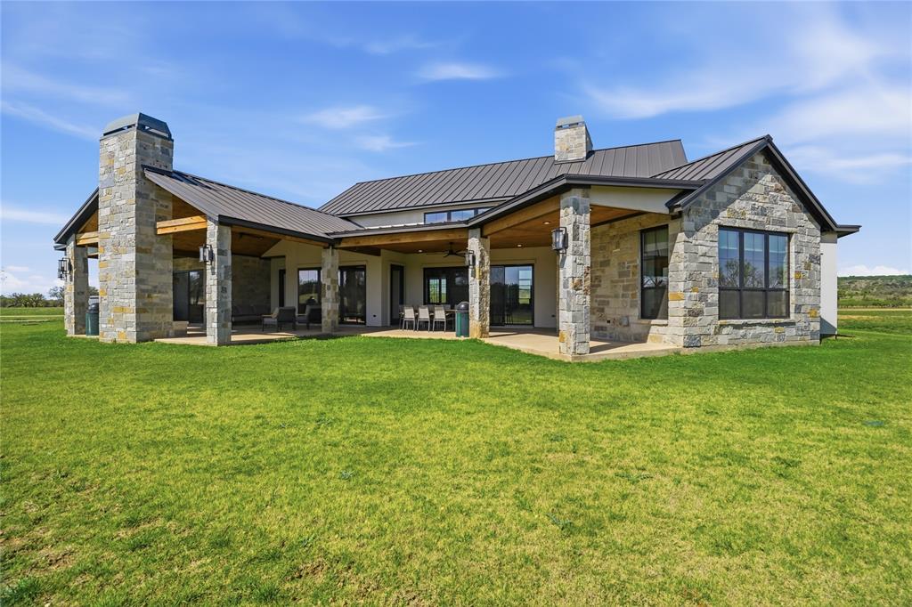 1010 Ranger Ridge Way Strawn, TX 76475 - Photo 35 of 40 front view of a house with a yard