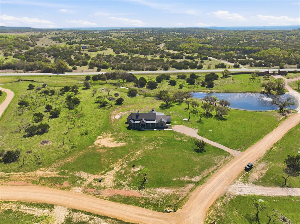 1010 Ranger Ridge Way Strawn, TX 76475 - Photo 37 of 40 a view of a lake with a city