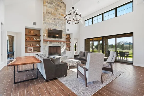 a living room with fireplace furniture and a flat screen tv