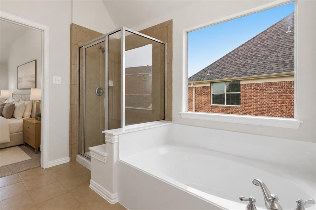 2841 Meadow Ridge Drive Prosper, TX 75078 - Photo 35 of 40 a bathroom with a bathtub and a shower