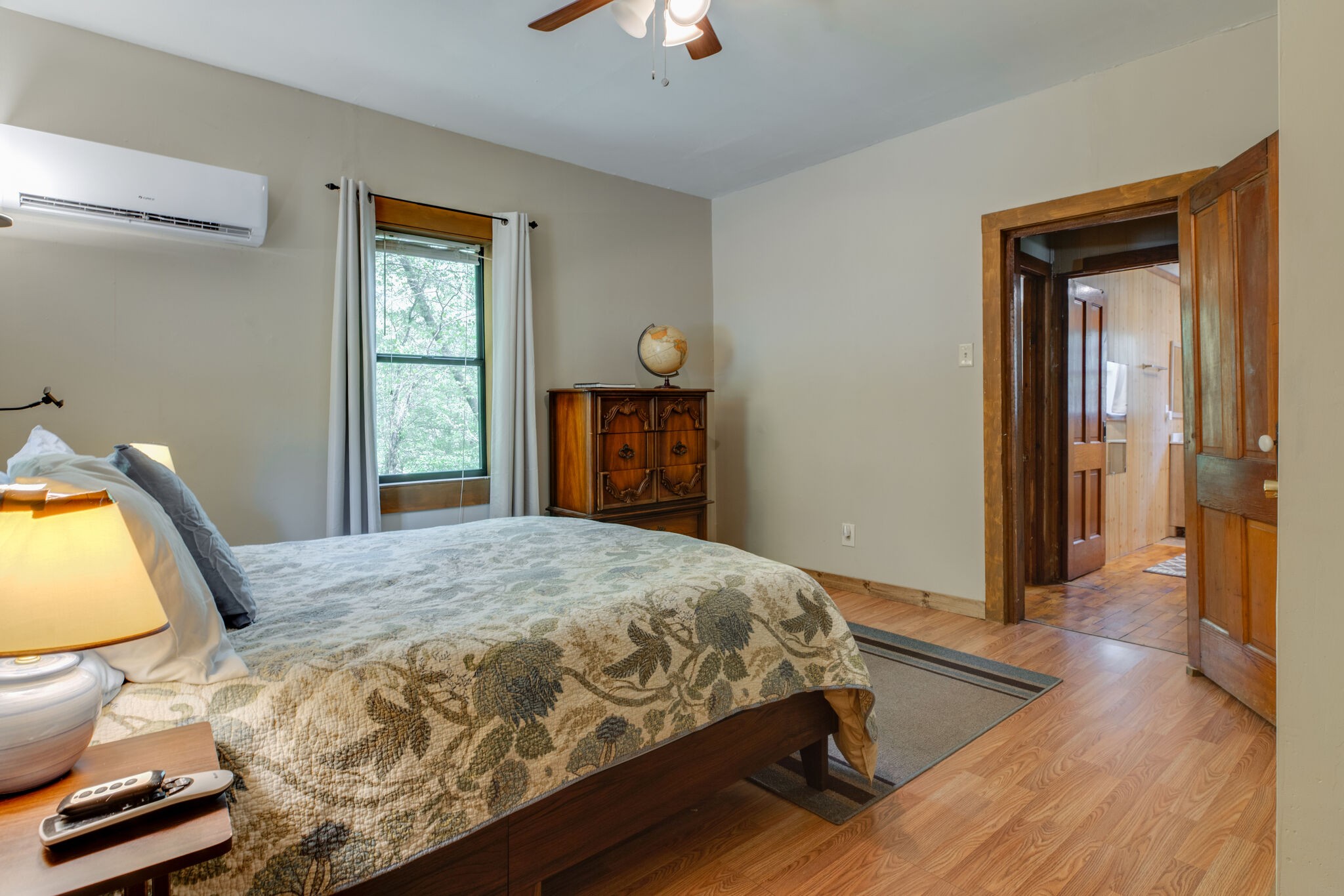 7196 Pinewood Road Nunnelly, TN 37137 - Photo 18 of 49 a bedroom with a bed and a chandelier