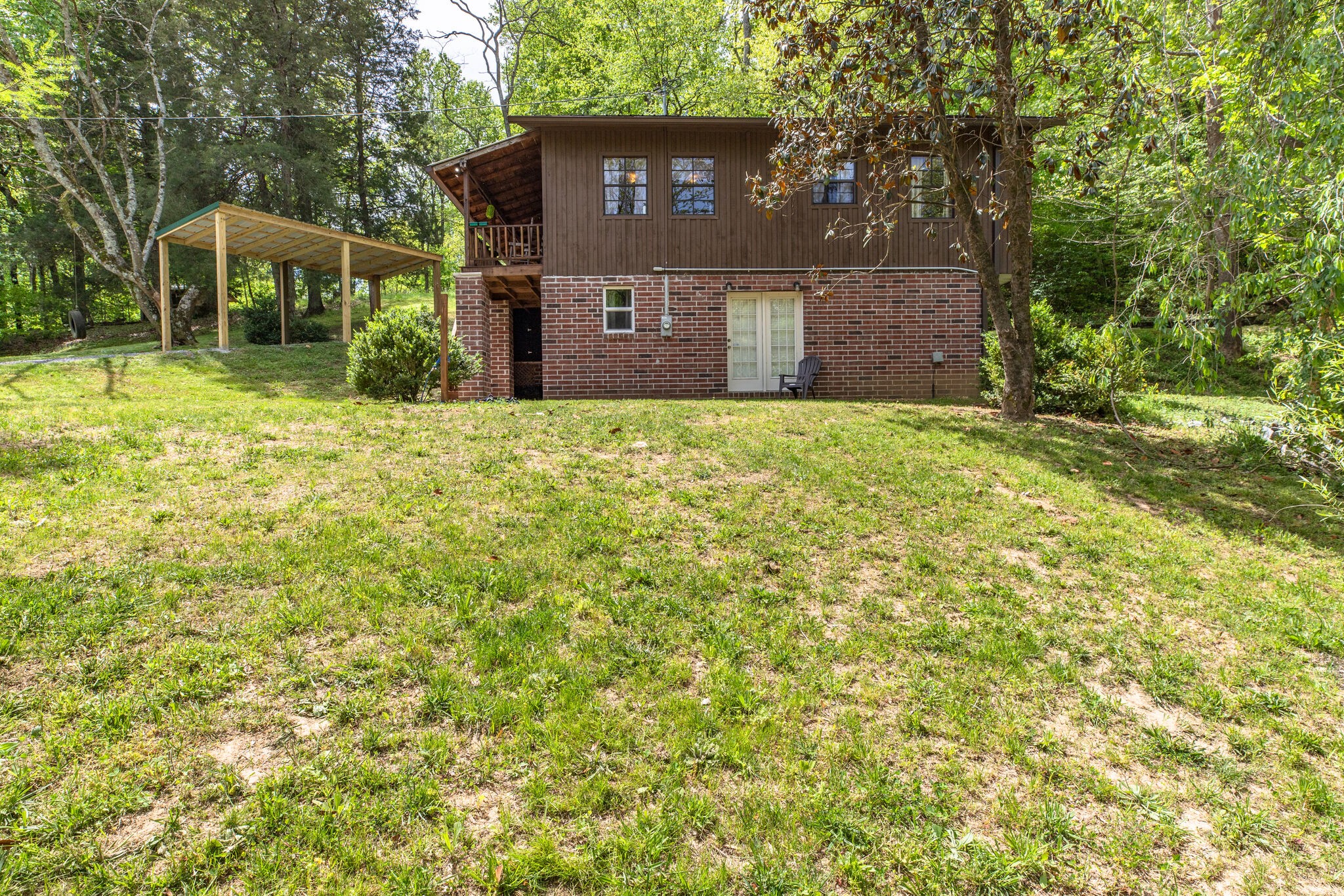 7196 Pinewood Road Nunnelly, TN 37137 - Photo 20 of 49 a view of a house with a yard