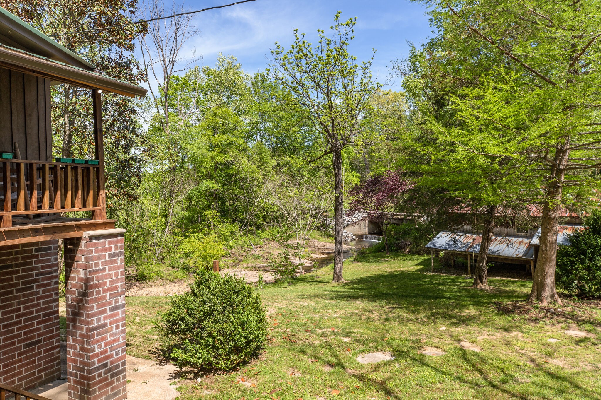 7196 Pinewood Road Nunnelly, TN 37137 - Photo 2 of 49 a backyard of a house with lots of green space