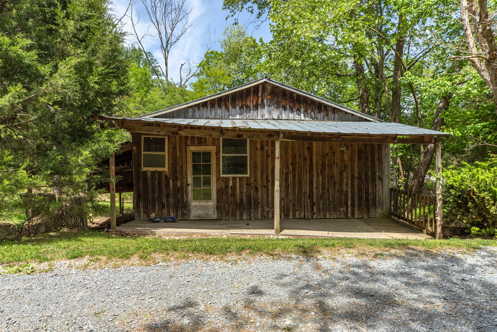7196 Pinewood Road Nunnelly, TN 37137 - Photo 25 of 49 a front view of a house with a garden