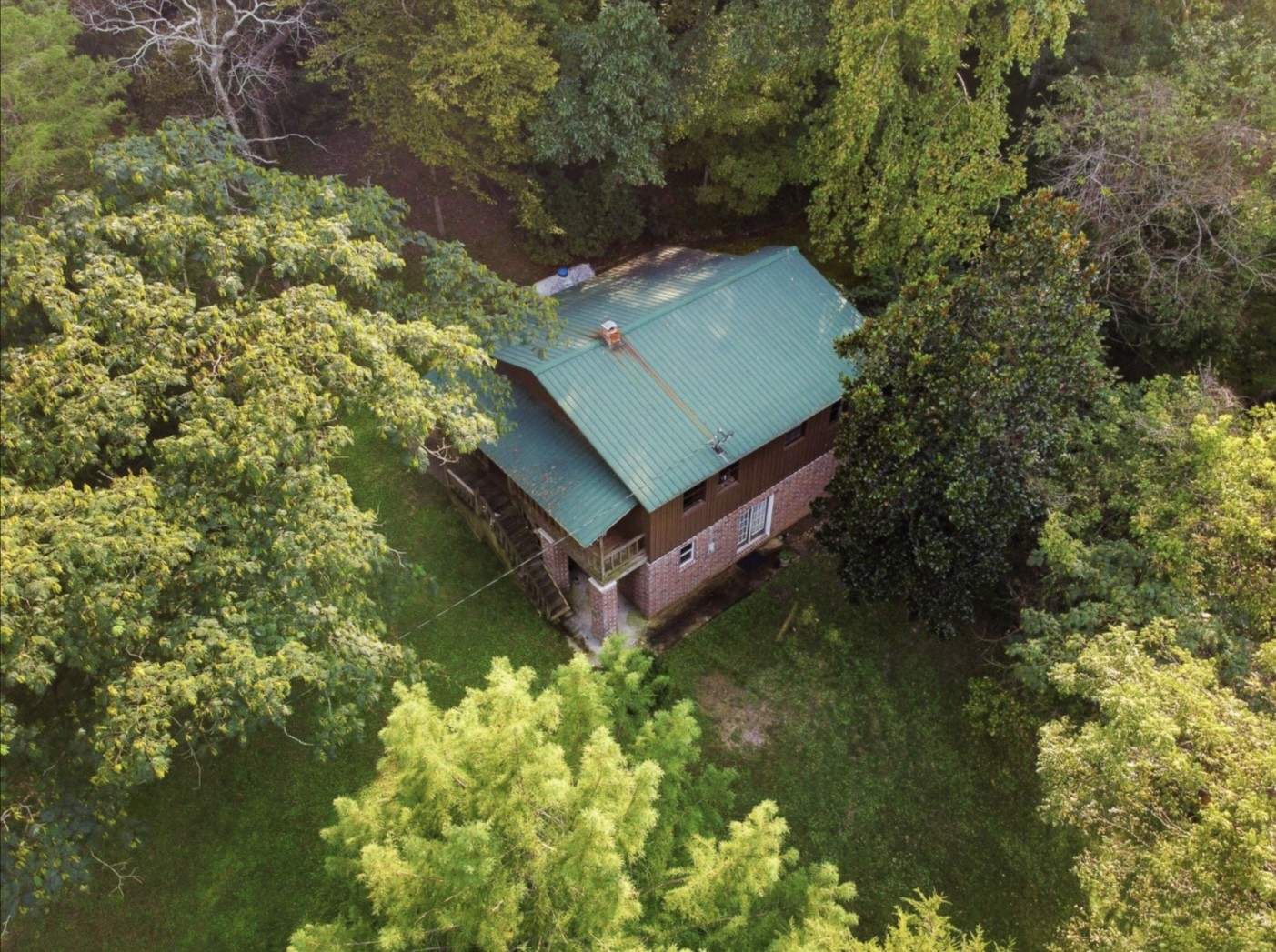 7196 Pinewood Road Nunnelly, TN 37137 - Photo 32 of 49 a view of a yard with plants