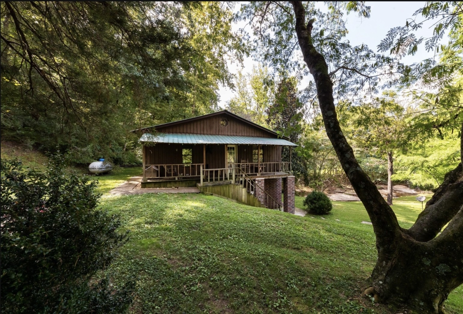 7196 Pinewood Road Nunnelly, TN 37137 - Photo 39 of 49 a view of an house with backyard space and sitting area