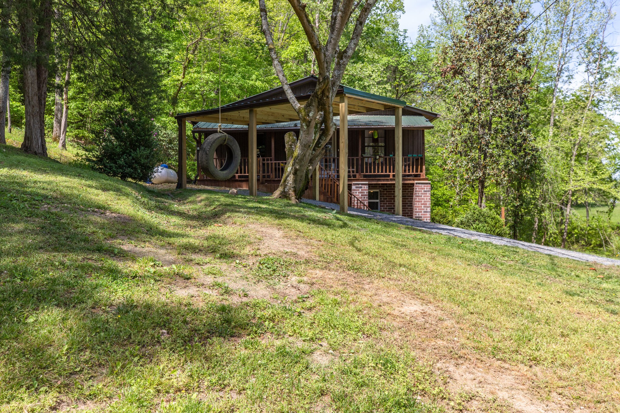 7196 Pinewood Road Nunnelly, TN 37137 - Photo 7 of 49 a view of a house with backyard and garden