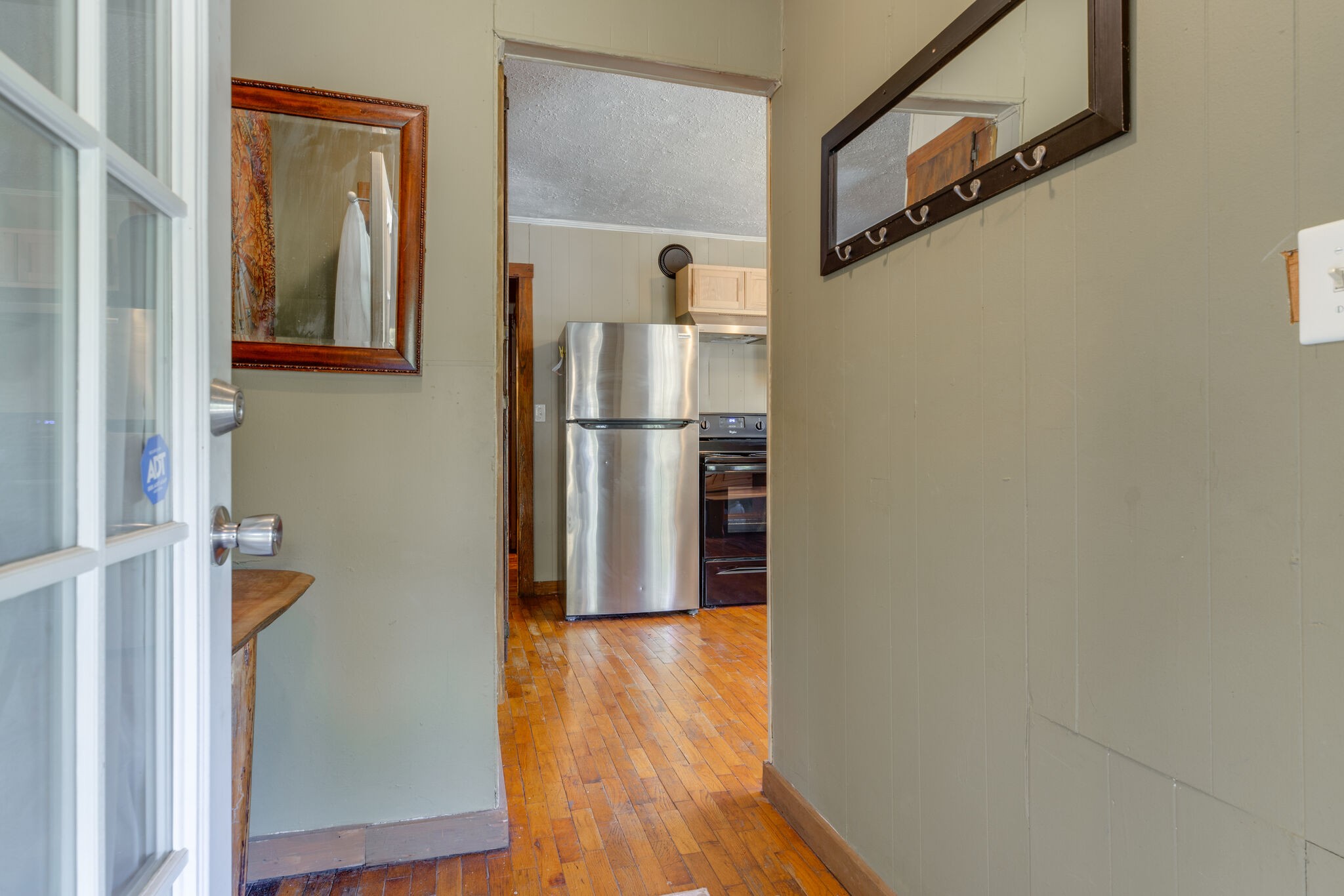 7196 Pinewood Road Nunnelly, TN 37137 - Photo 8 of 49 a view of a hallway with wooden floor and staircase