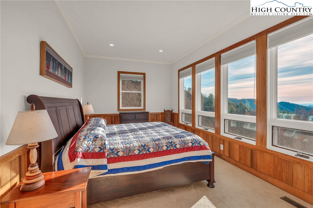 933 Thunder Ridge Lane Lenoir, NC 28645 - Photo 28 of 45 a bedroom with bed and a large window