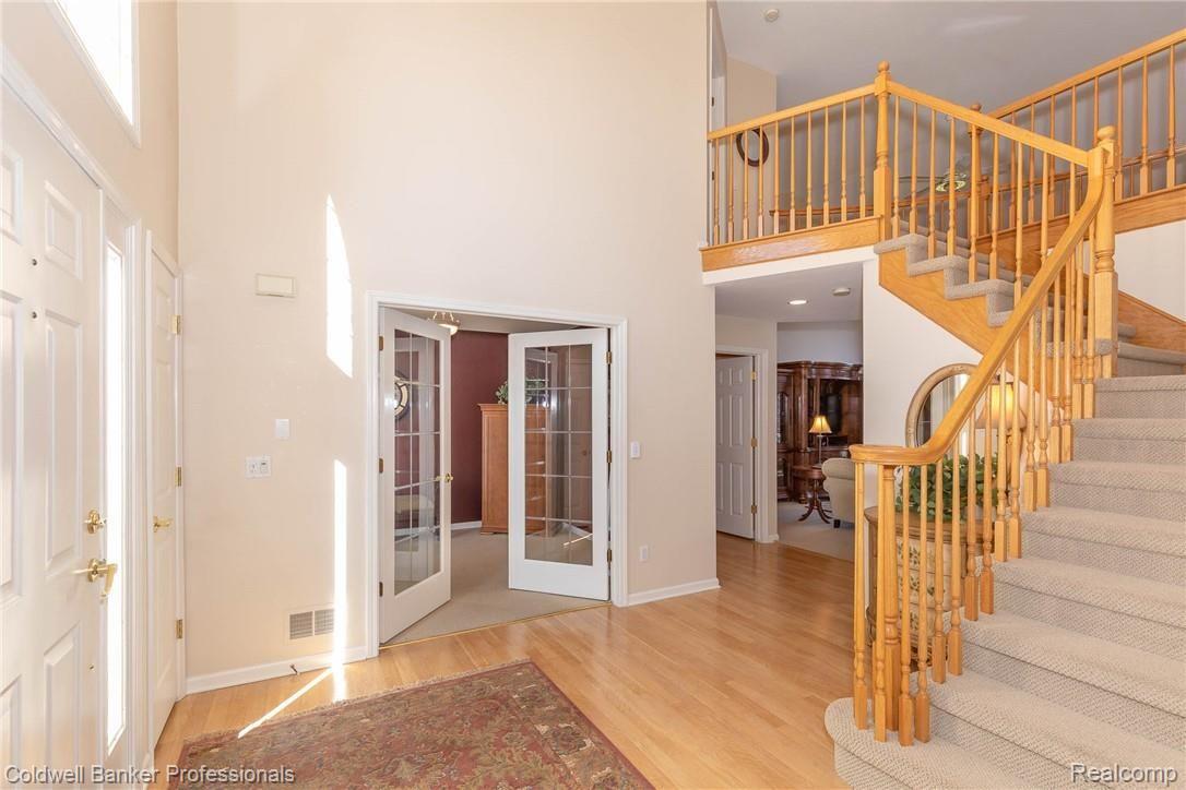 304 Lone Pine Circle Rochester, MI 48307 - Photo 5 of 31 Handsome Staircase, Double Doors to LB