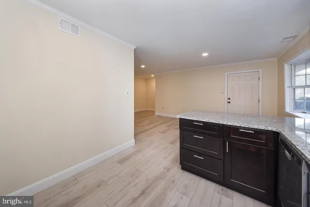 a view of room with wooden floor