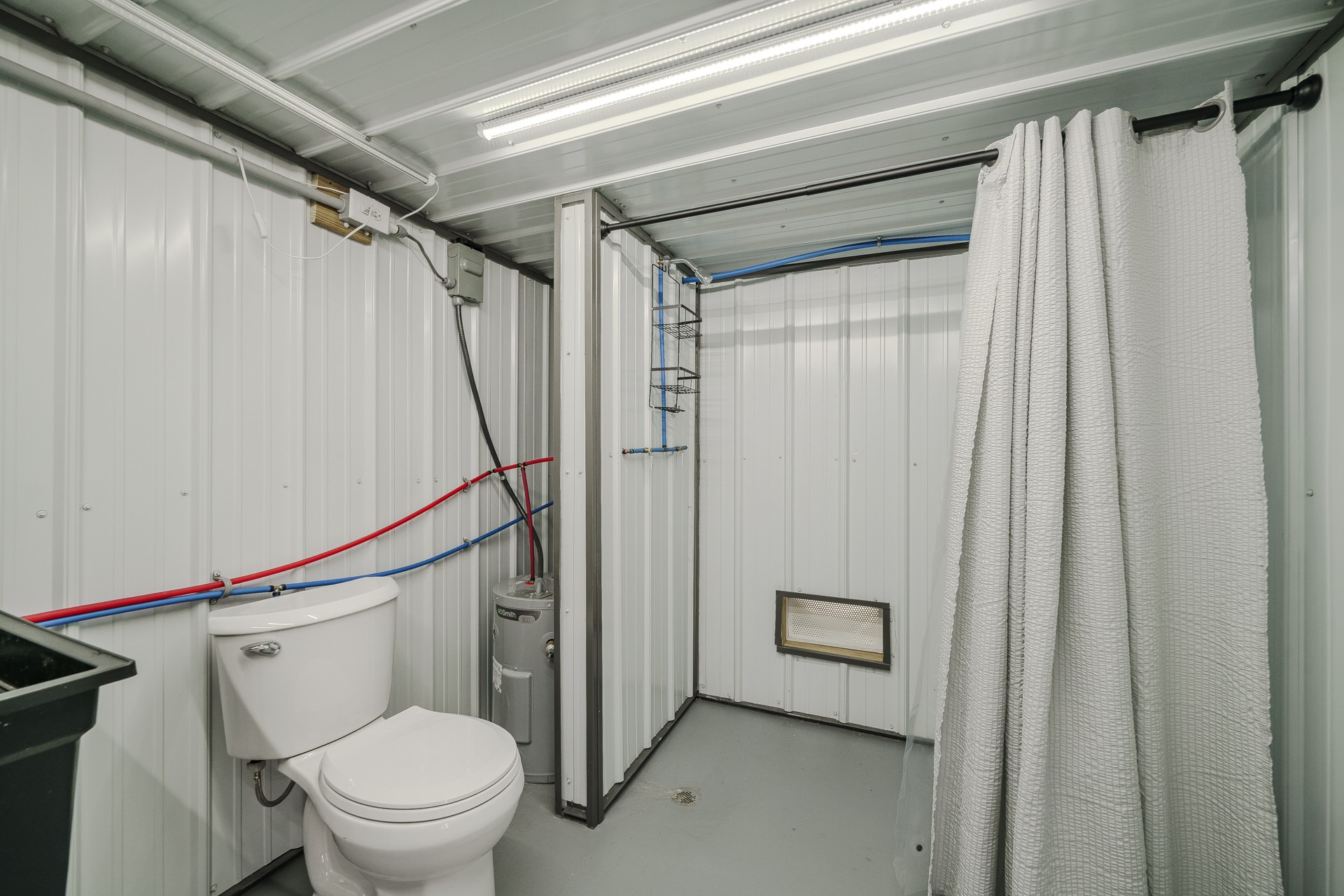1082 WC PICKETT Road Clifton, TN 38425 - Photo 46 of 75 a bathroom with a shower a toilet and a sink