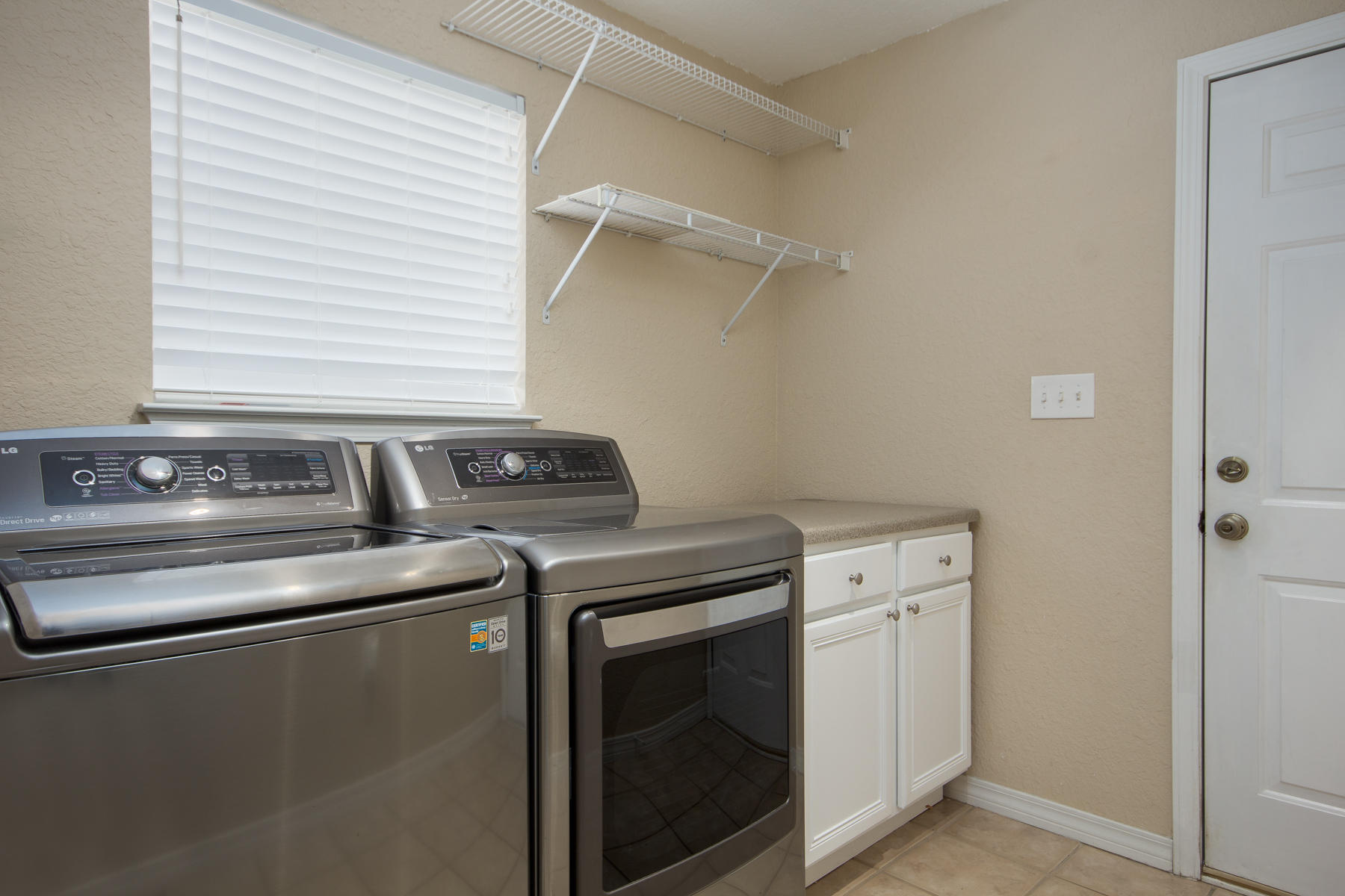 166 East Shipwreck Road Santa Rosa Beach, FL 32459 - Photo 12 of 33 a utility room with dryer and washer