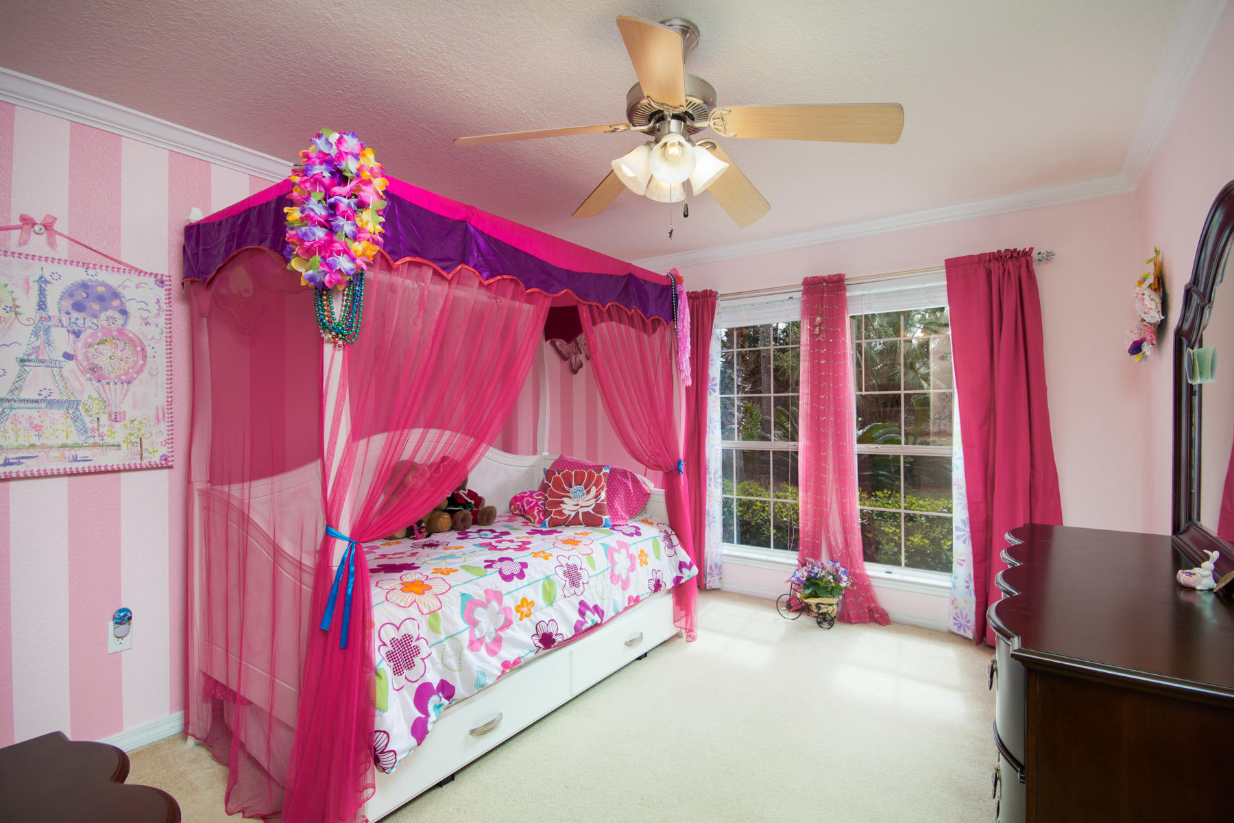 166 East Shipwreck Road Santa Rosa Beach, FL 32459 - Photo 23 of 33 a bedroom with a bed and a chandelier