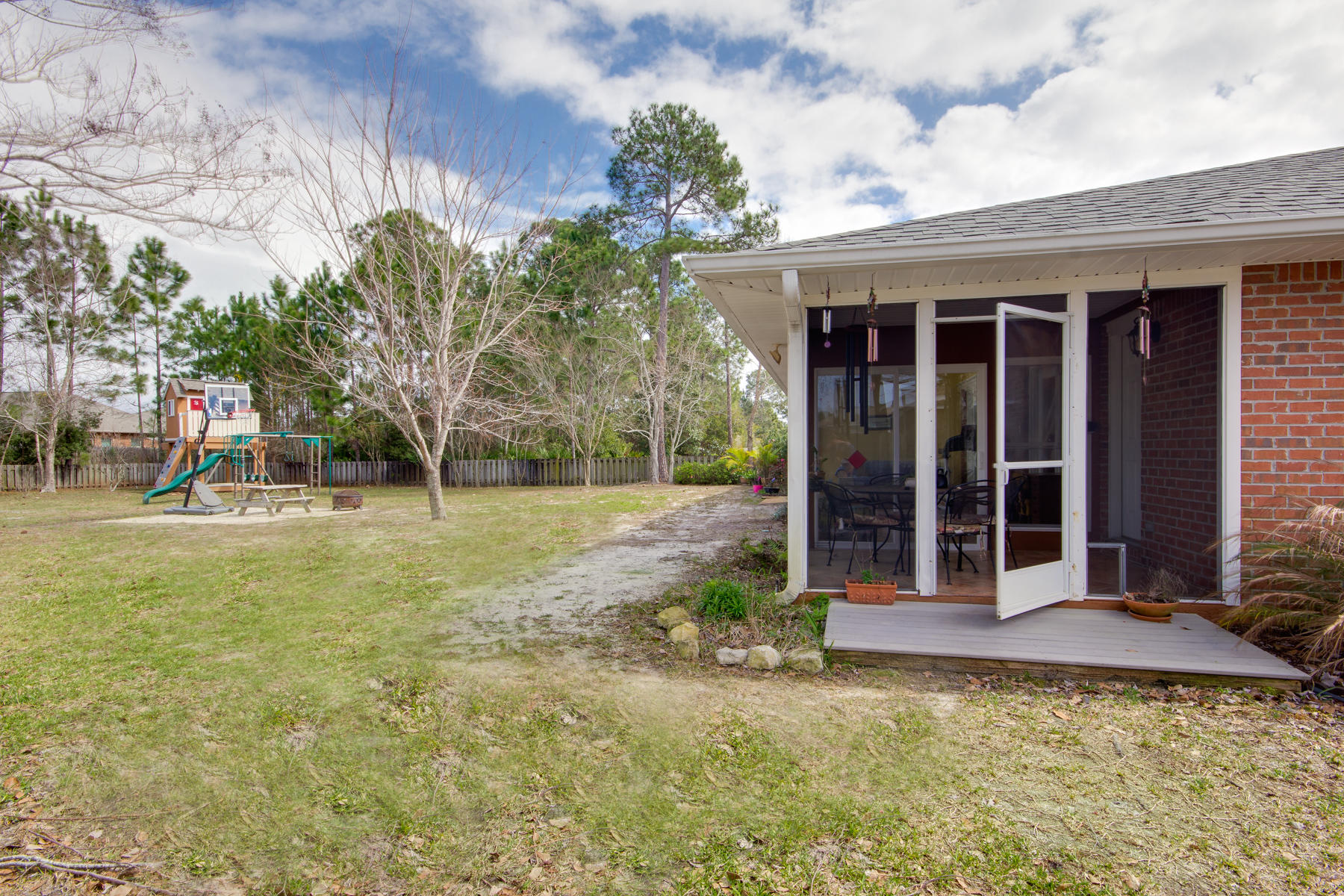 166 East Shipwreck Road Santa Rosa Beach, FL 32459 - Photo 28 of 33 a view of a house with backyard and sitting area