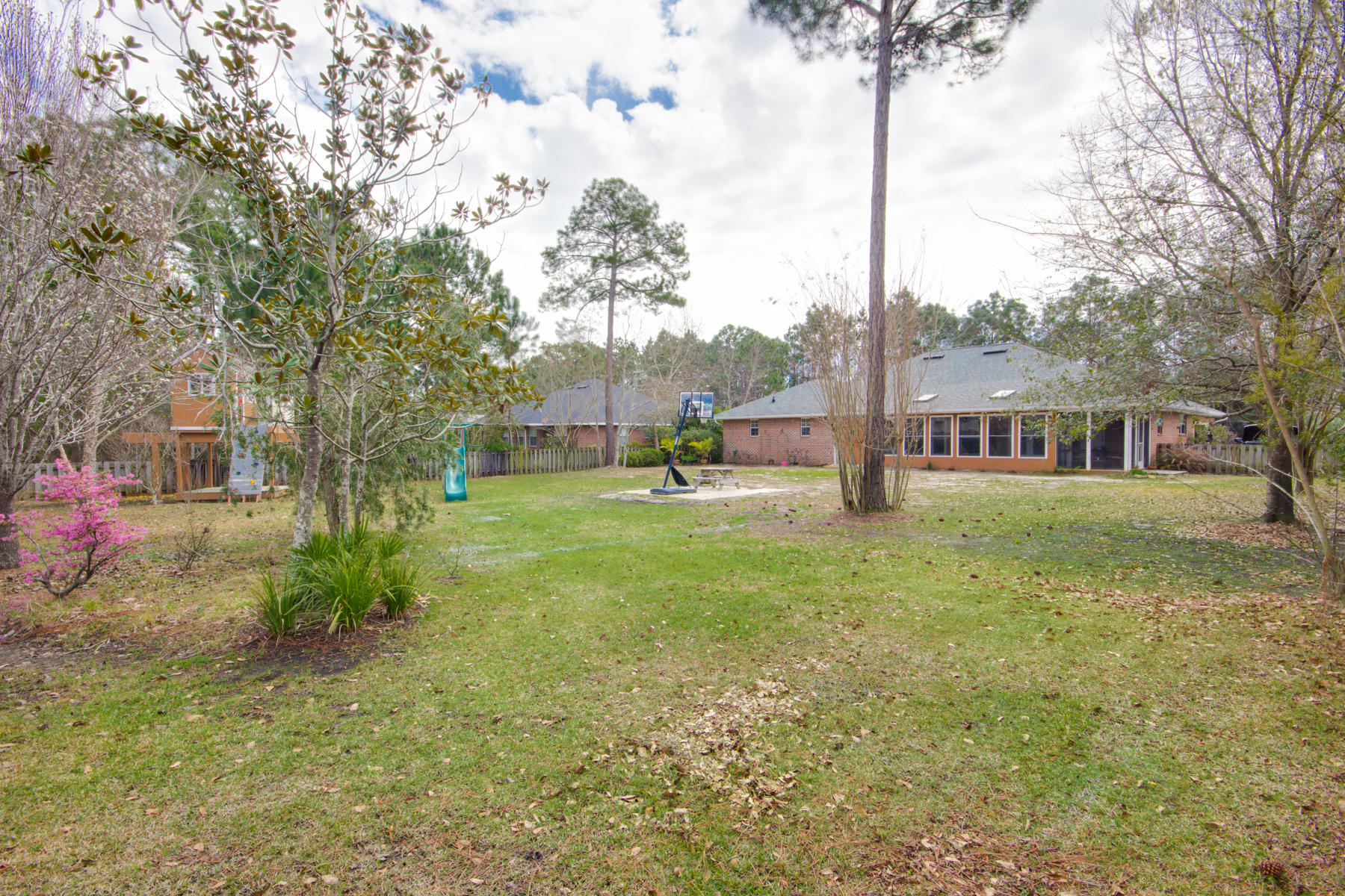 166 East Shipwreck Road Santa Rosa Beach, FL 32459 - Photo 29 of 33 a view of a house with backyard and sitting area