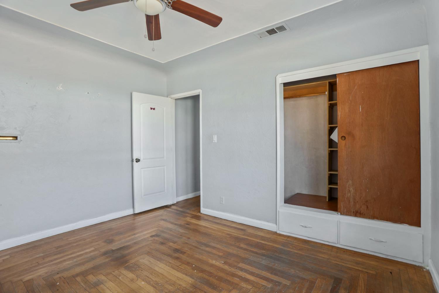 916 Elm Avenue Modesto, CA 95351 - Photo 21 of 52 22. Bedroom with built-in closet Built-in storage gives this bedroom extra character — and yes, a little old-house personality comes included.