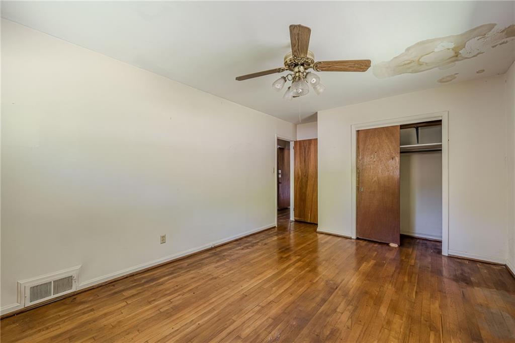 1502 North Druid Hills Road Brookhaven, GA 30319 - Photo 20 of 46 a view of an empty room with wooden floor