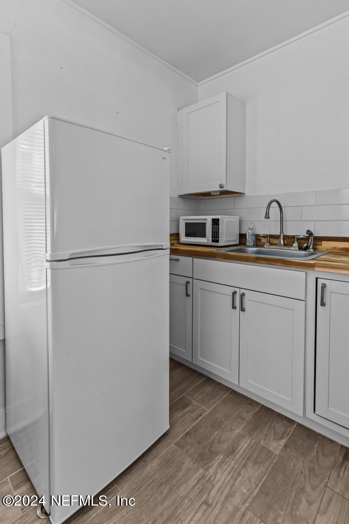 313 A St George Street St. Augustine, FL 32084 - Photo 13 of 21 a white refrigerator freezer sitting inside of a kitchen