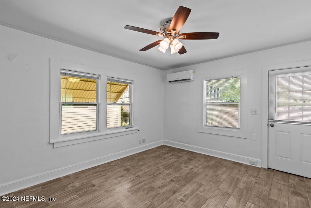 313 A St George Street St. Augustine, FL 32084 - Photo 5 of 21 a view of empty room with wooden floor and fan