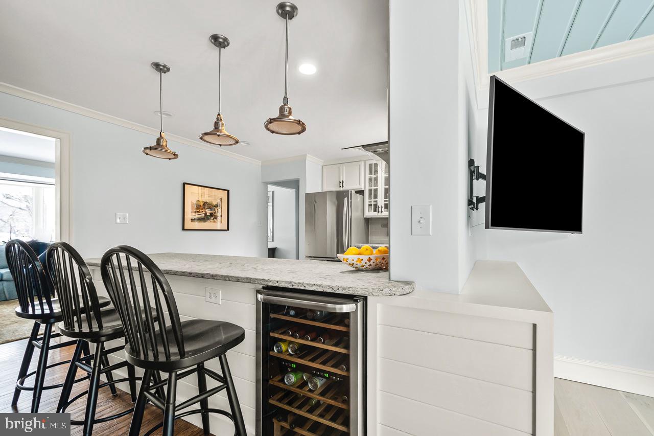 5005 Rhoades Place Alexandria, VA 22304 - Photo 14 of 55 KITCHEN WITH WINE FRIDGE, BAR SEATING & WOOD WORK