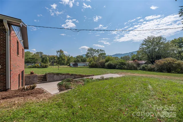 a view of a building with a big yard