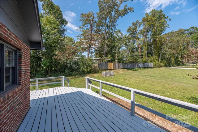 a view of sitting space with swimming pool and wooden floor