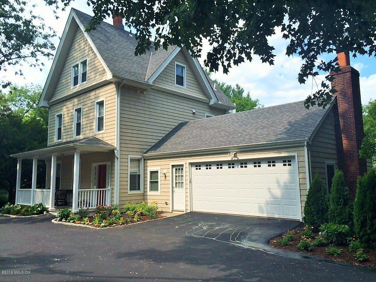 44 Riversville Road Greenwich, CT 06831 - Photo 1 of 19 a front view of a house with a garden