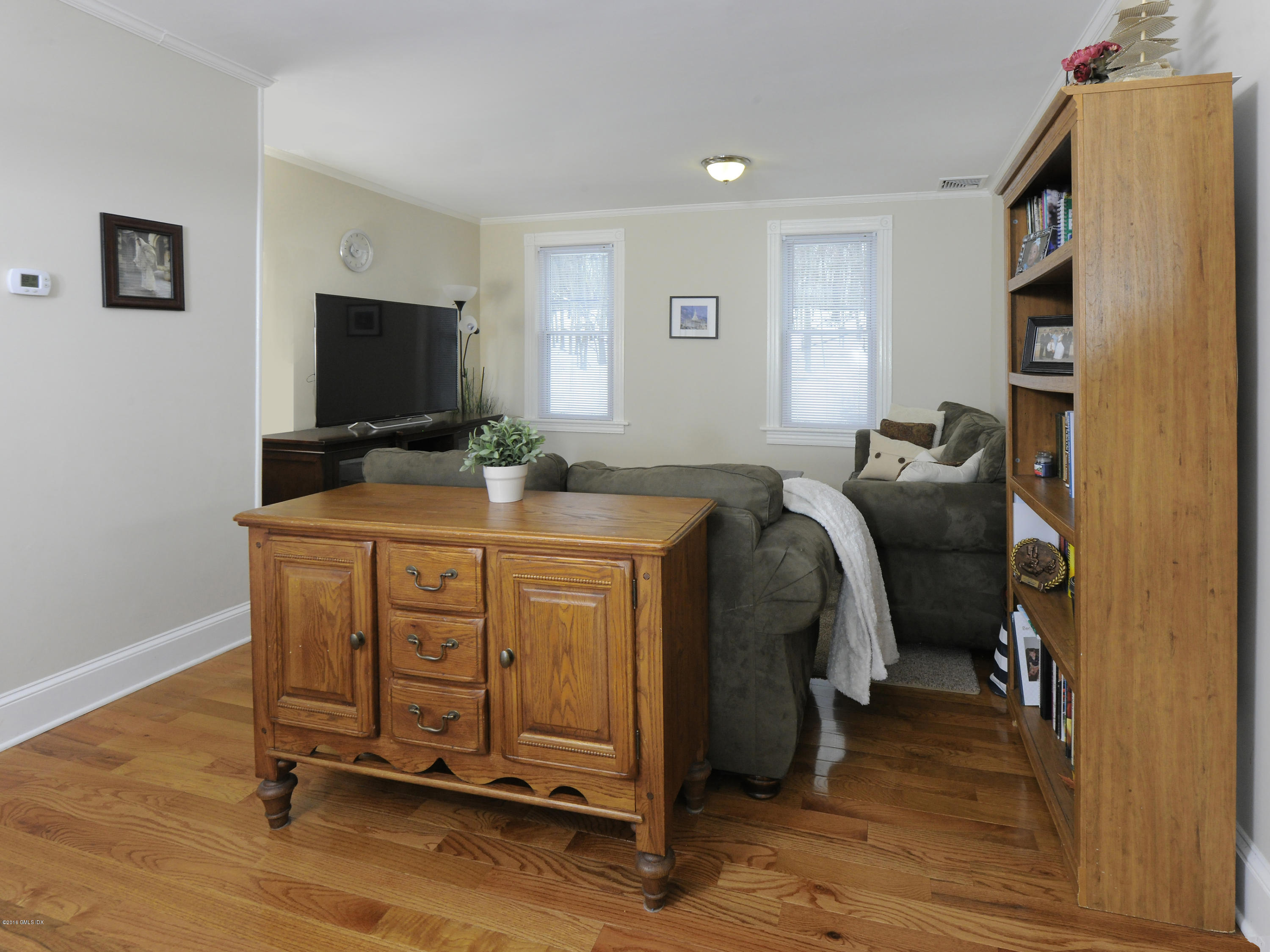44 Riversville Road Greenwich, CT 06831 - Photo 8 of 19 a room with furniture and a flat screen tv