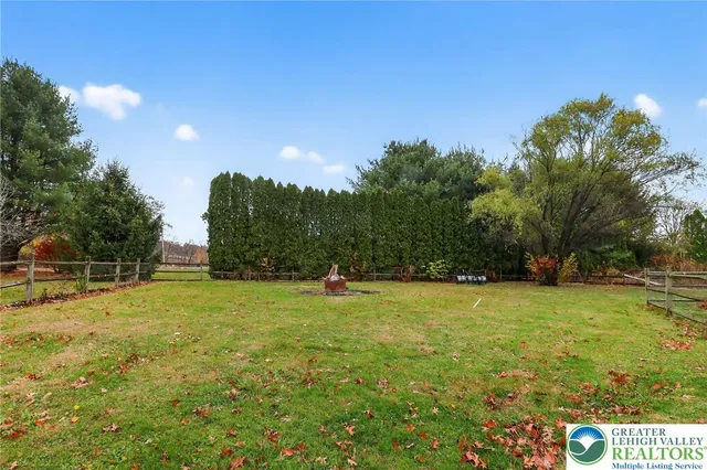a swimming pool with trees in the background