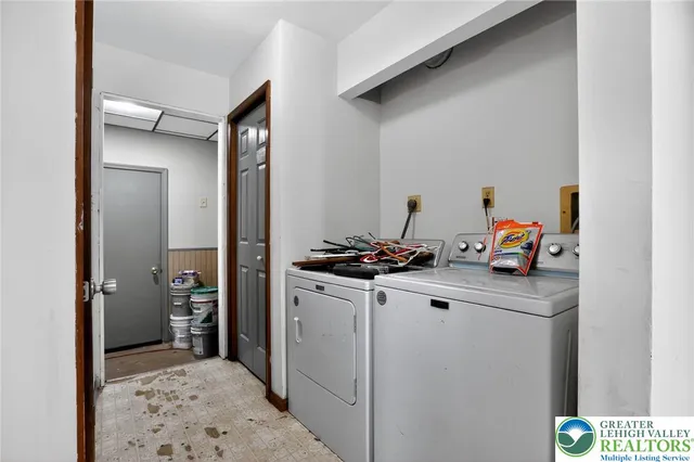 a utility room with closet dryer and washer