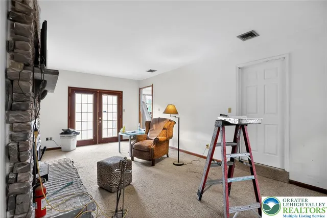 a bedroom with furniture and a window