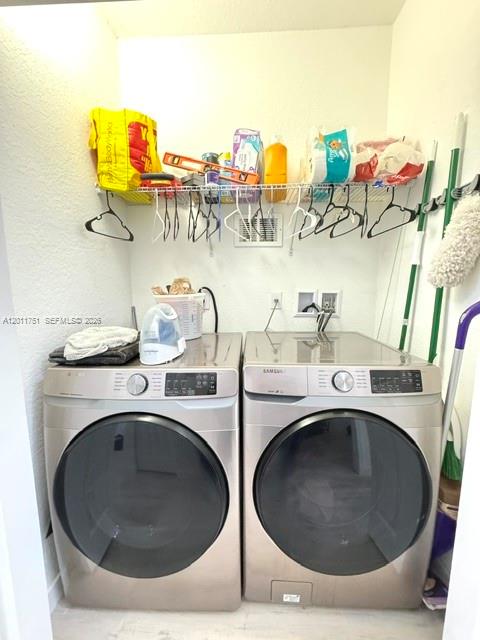 15650 Southwest 136th Street, Unit 101 Miami, FL 33196 - Photo 13 of 16 a utility room with sink dryer and washer