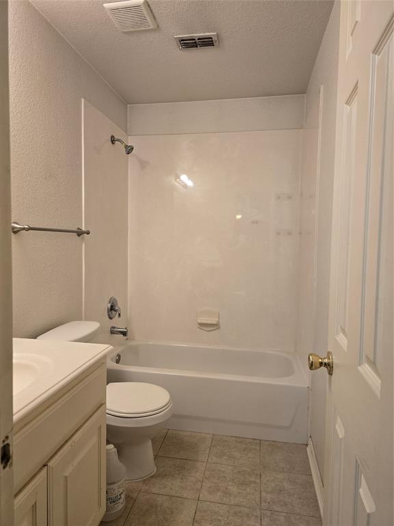 100 Bryan Street Prosper, TX 75078 - Photo 12 of 18 a bathroom with a toilet a sink and bathtub