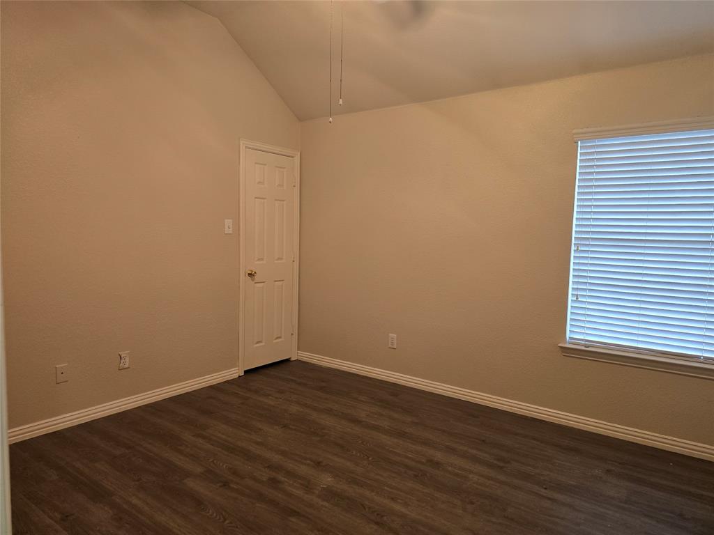 100 Bryan Street Prosper, TX 75078 - Photo 14 of 18 a view of an empty room with wooden floor and a window