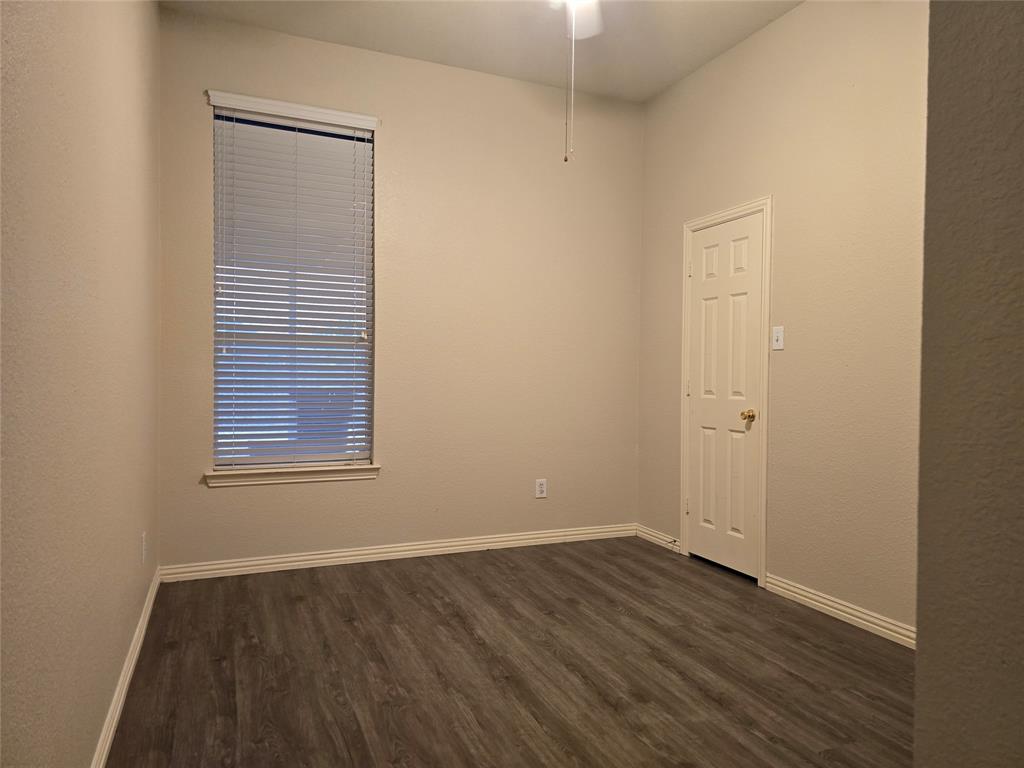 100 Bryan Street Prosper, TX 75078 - Photo 15 of 18 an empty room with wooden floor and windows