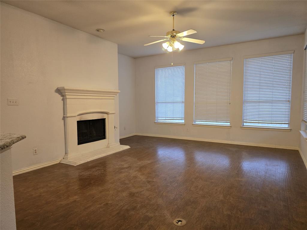 100 Bryan Street Prosper, TX 75078 - Photo 6 of 18 an empty room with windows and fireplace