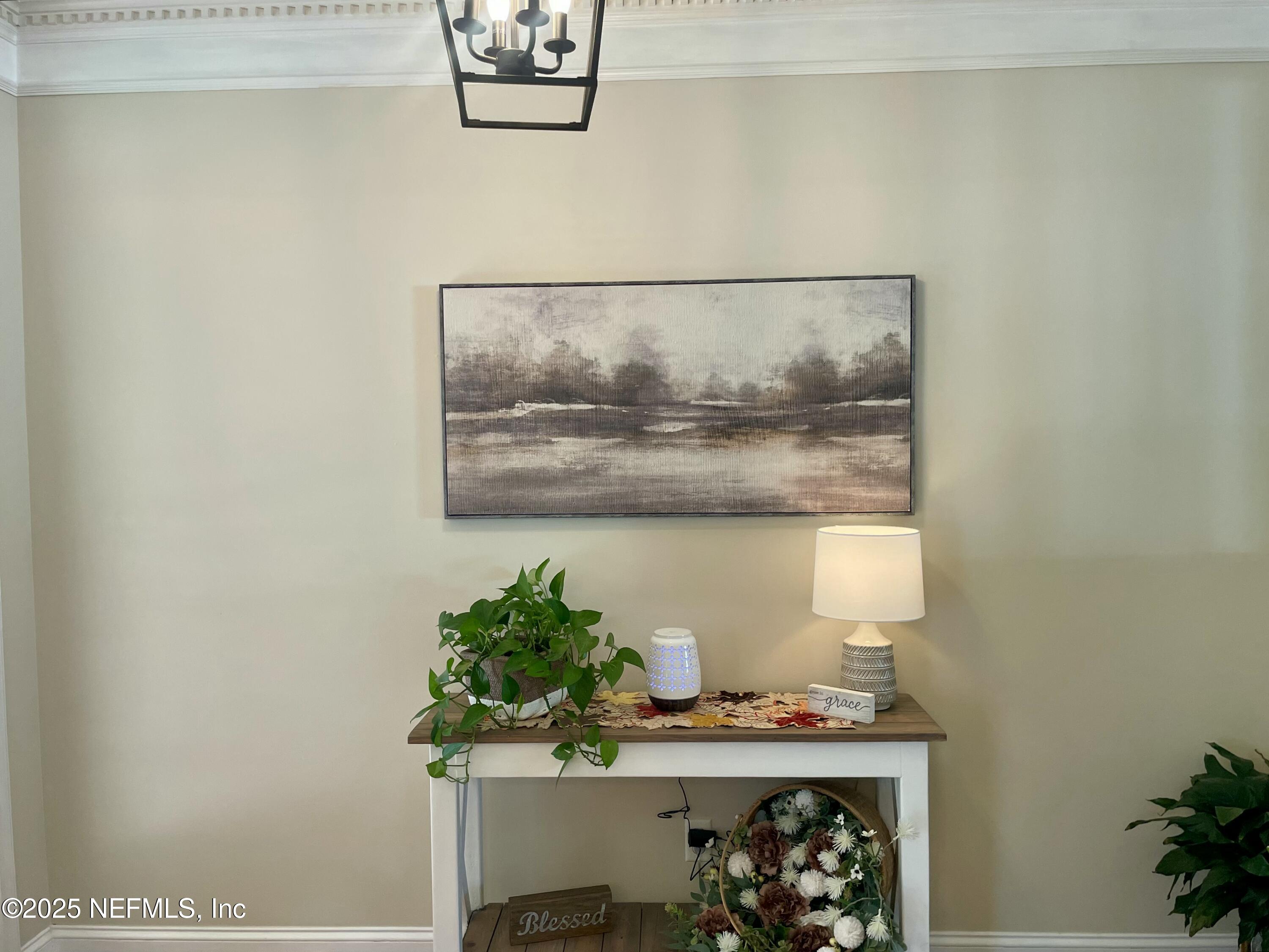 1168 Copper Gate Place Macclenny, FL 32063 - Photo 12 of 44 a room with a table and a potted plant