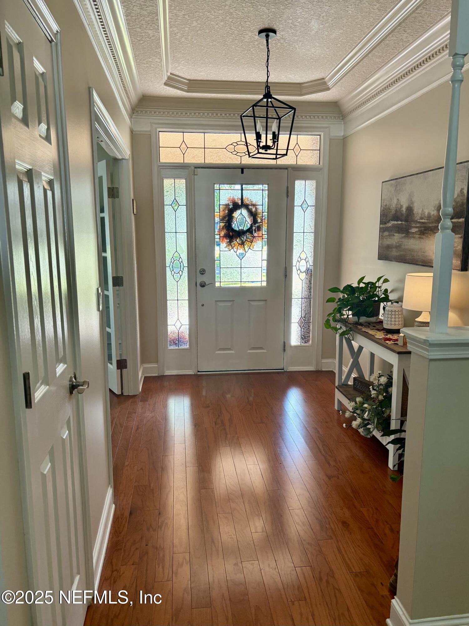 1168 Copper Gate Place Macclenny, FL 32063 - Photo 13 of 44 a view of a room with wooden floor and windows
