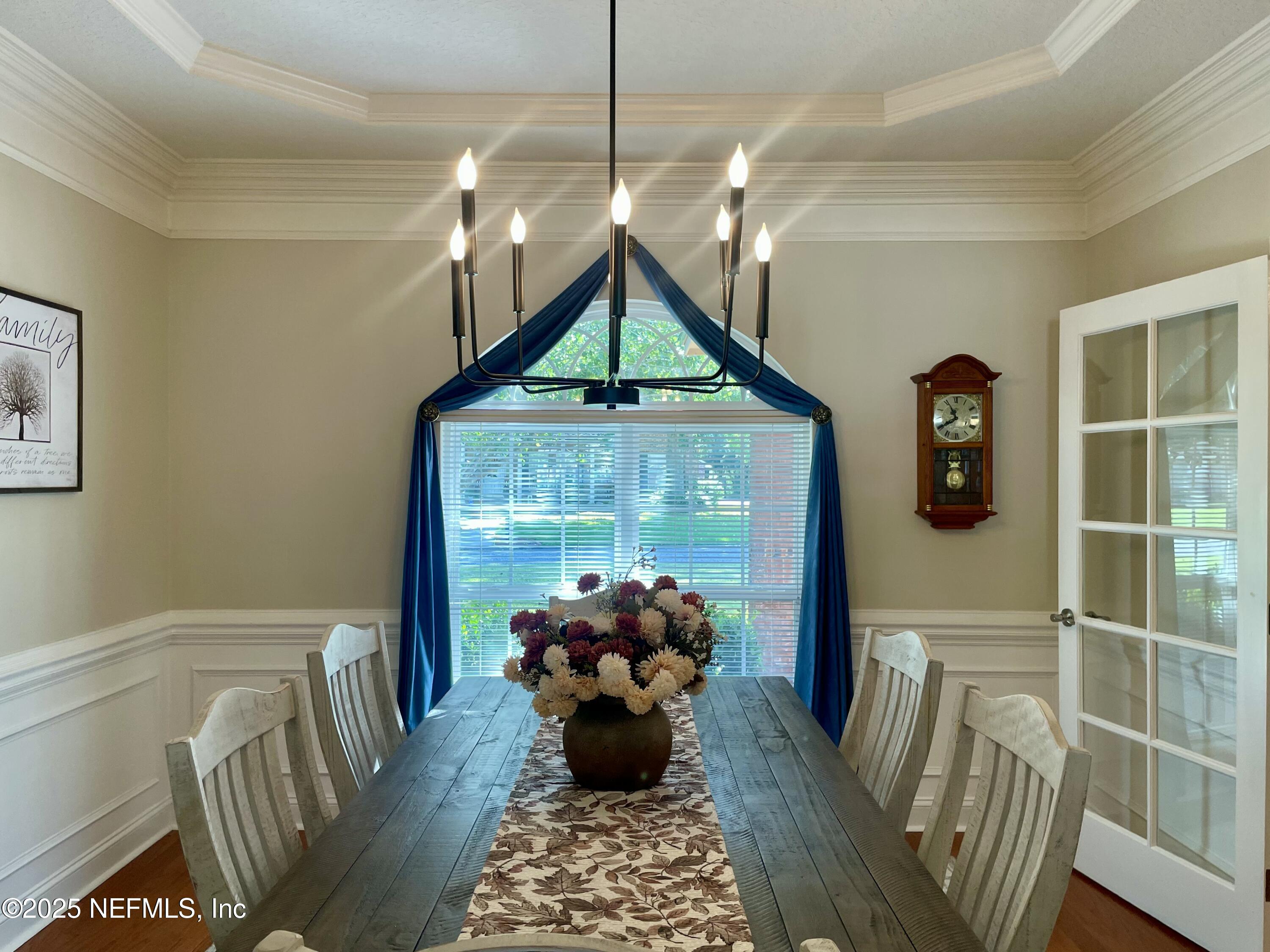 1168 Copper Gate Place Macclenny, FL 32063 - Photo 16 of 44 a living room with furniture and a chandelier