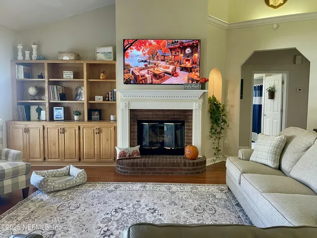 a living room with furniture and a fireplace
