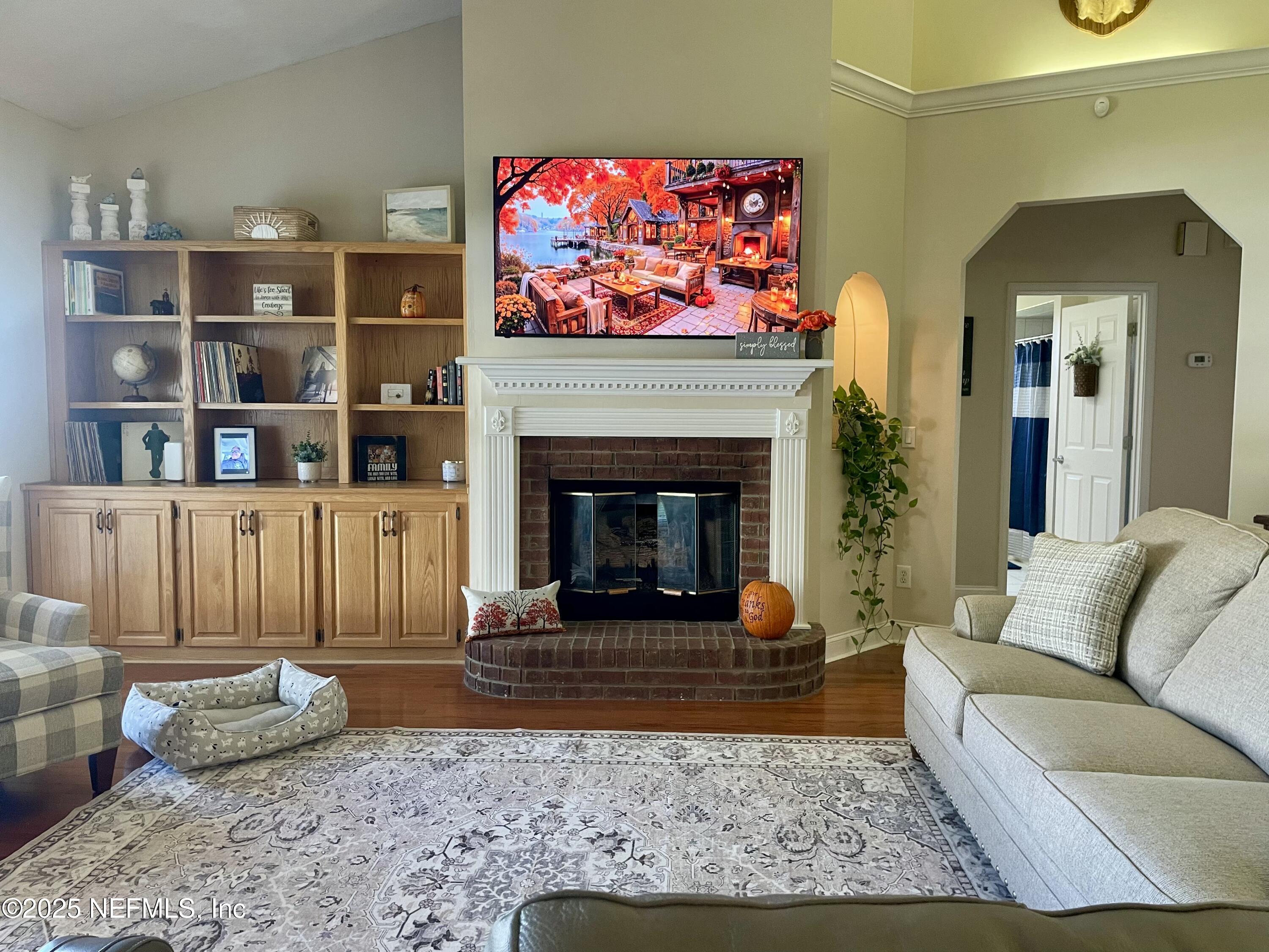1168 Copper Gate Place Macclenny, FL 32063 - Photo 18 of 44 a living room with furniture and a fireplace