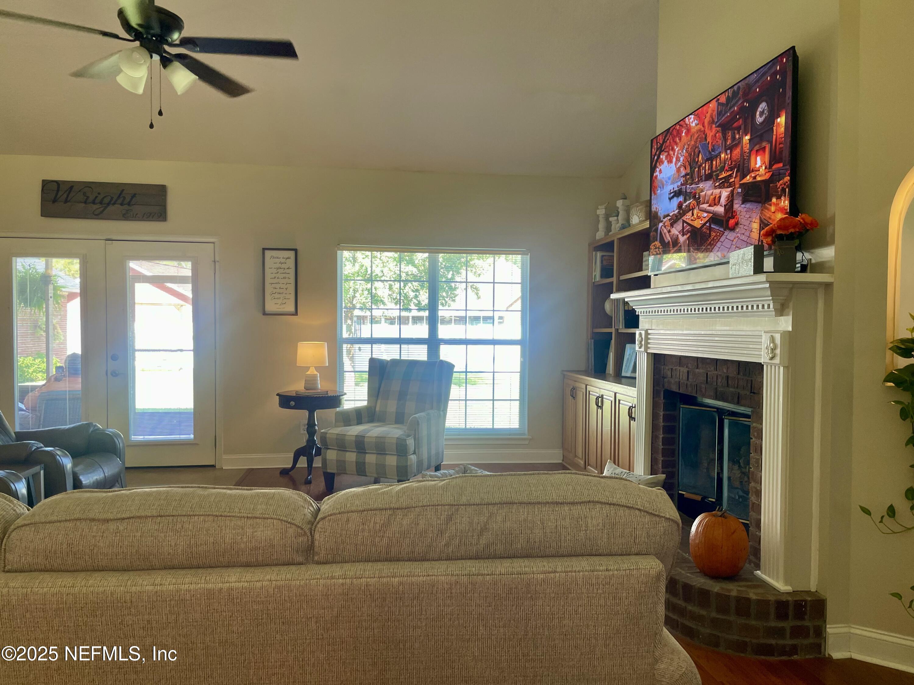1168 Copper Gate Place Macclenny, FL 32063 - Photo 20 of 44 a living room with furniture and a fireplace
