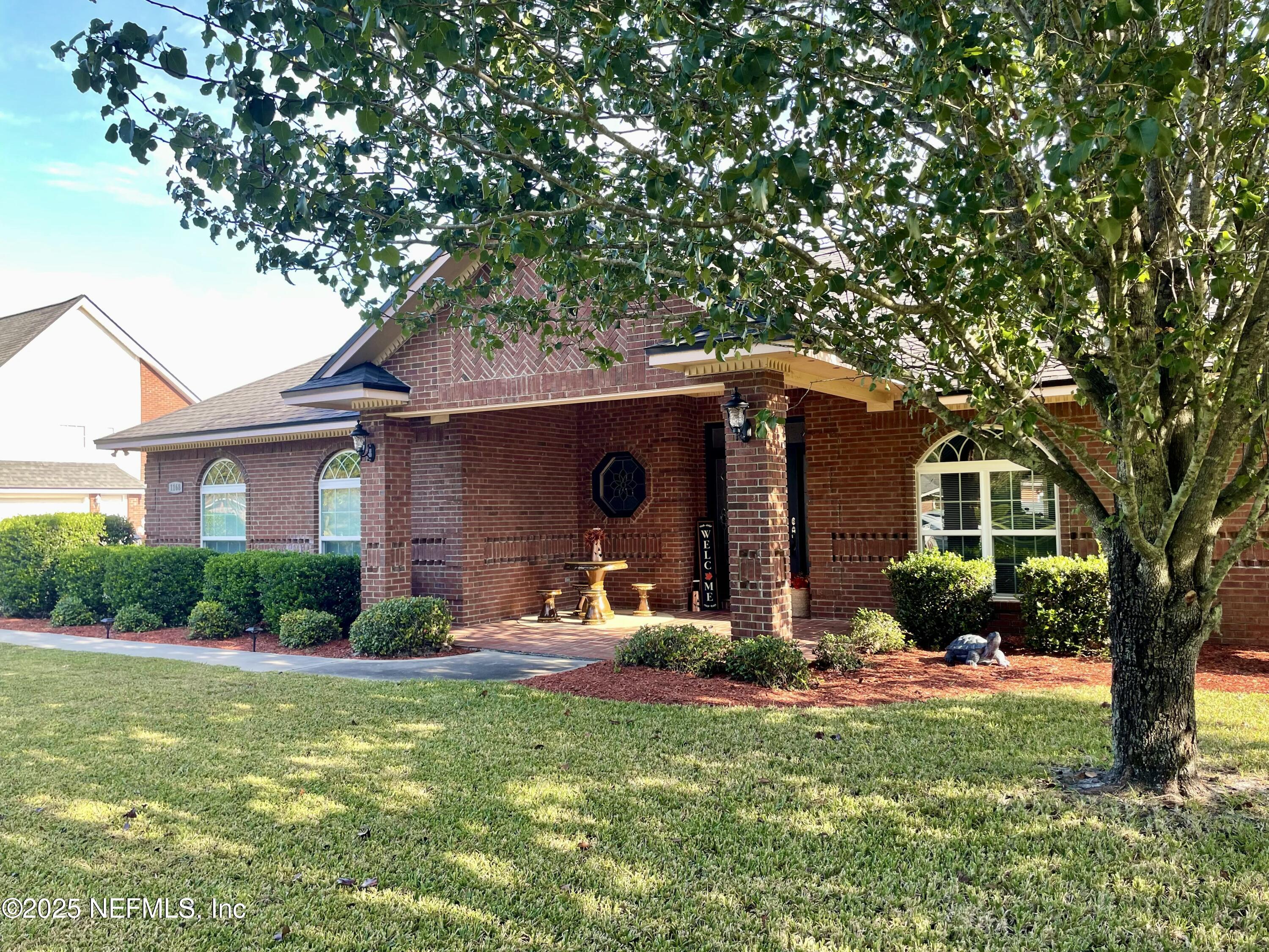 1168 Copper Gate Place Macclenny, FL 32063 - Photo 2 of 44 a front view of house with yard and green space