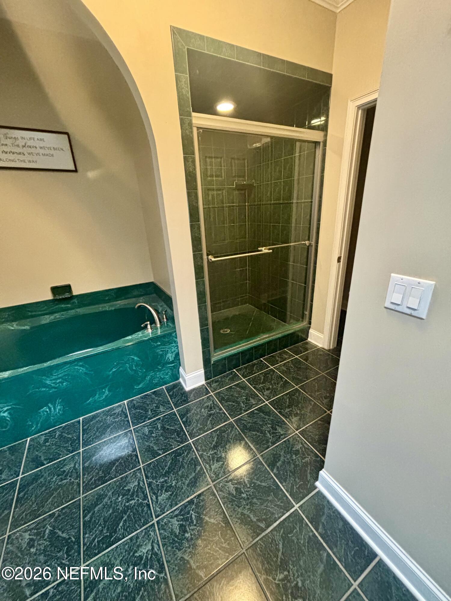 1168 Copper Gate Place Macclenny, FL 32063 - Photo 23 of 51 a bathroom with a glass shower door and a sink