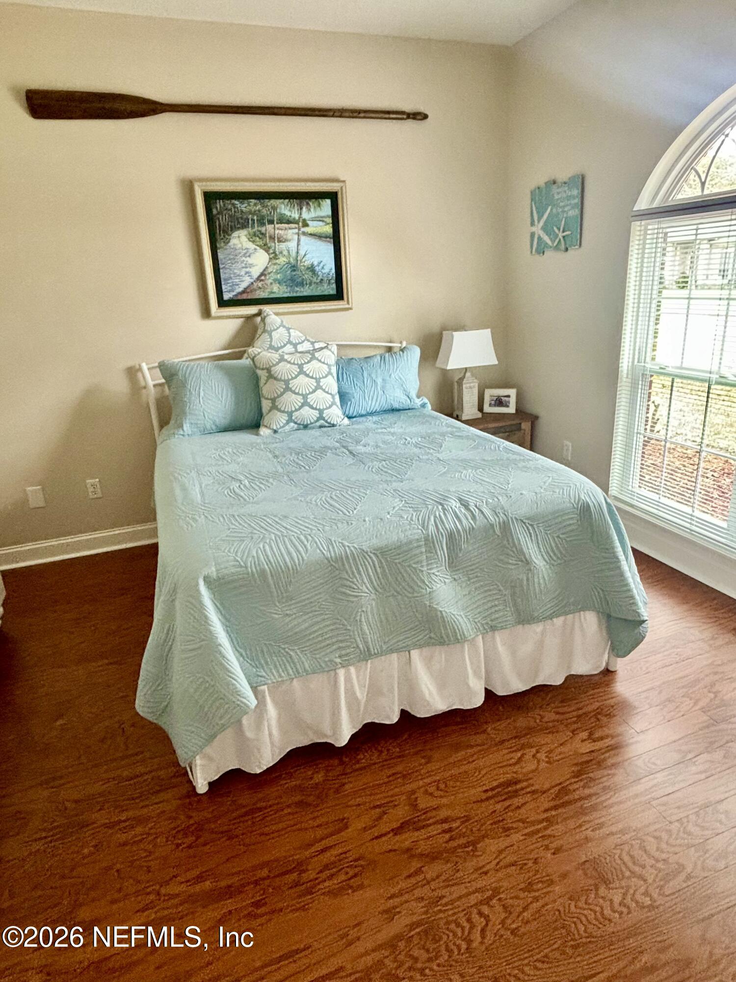 1168 Copper Gate Place Macclenny, FL 32063 - Photo 25 of 51 a bedroom with a bed and wooden floor