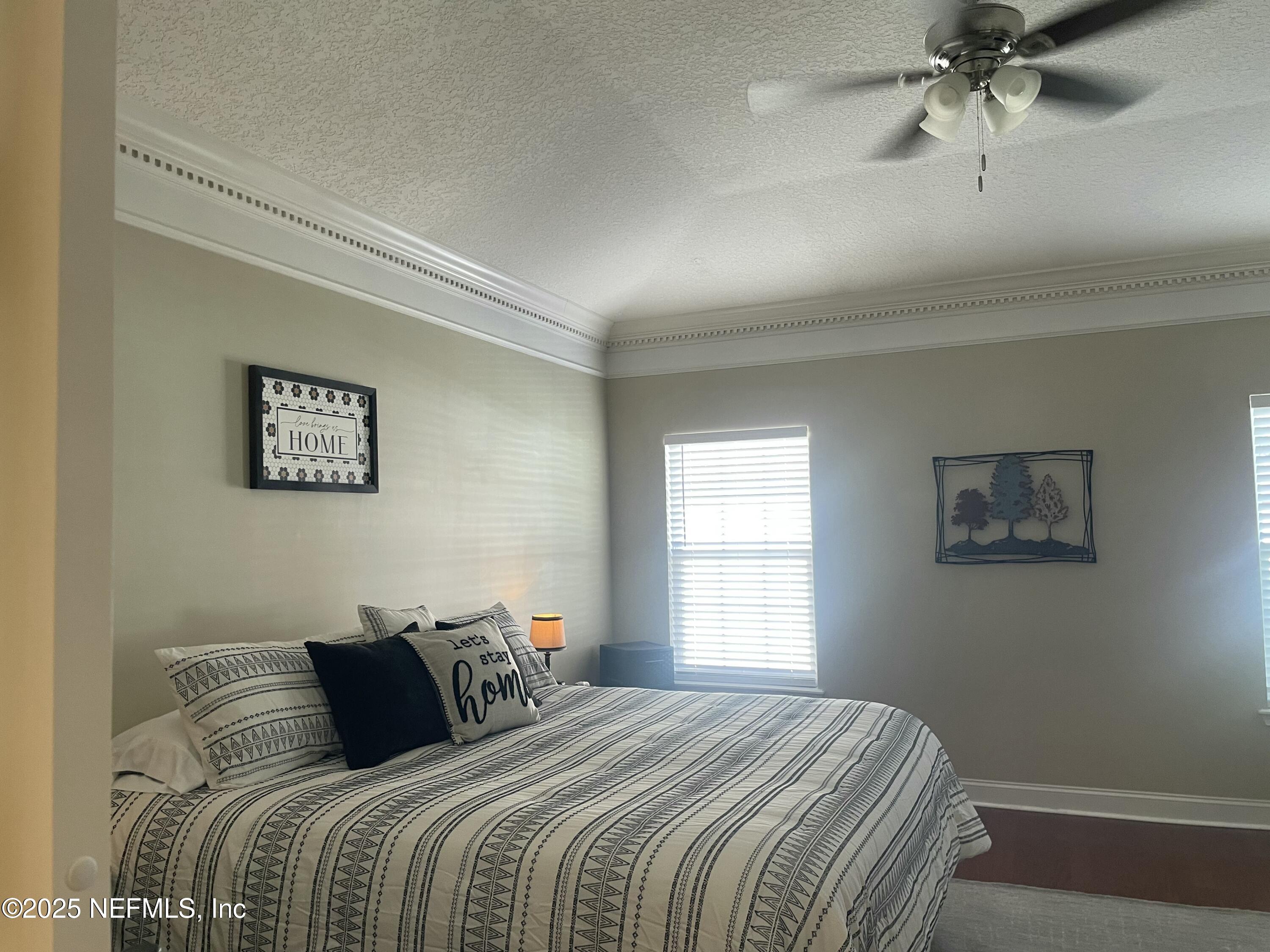 1168 Copper Gate Place Macclenny, FL 32063 - Photo 26 of 44 a bedroom with a bed and a window
