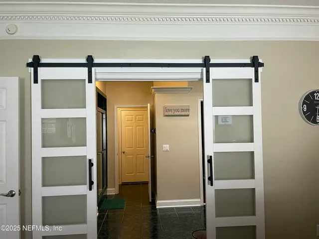a bathroom with a shower and a mirror
